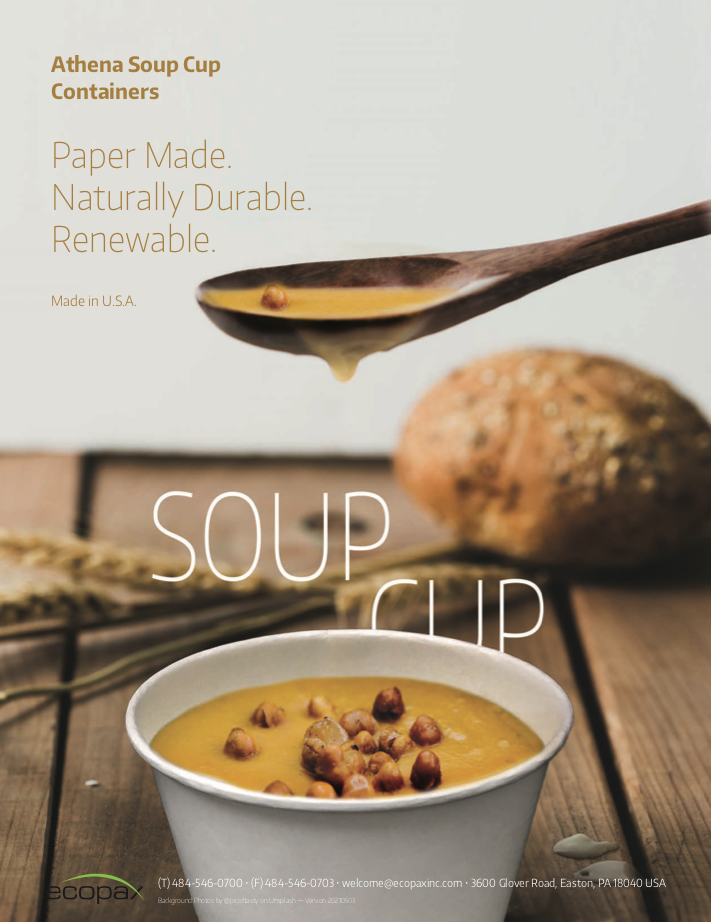 Paper soup cup with pumpkin seed autume soup and wooden spoon